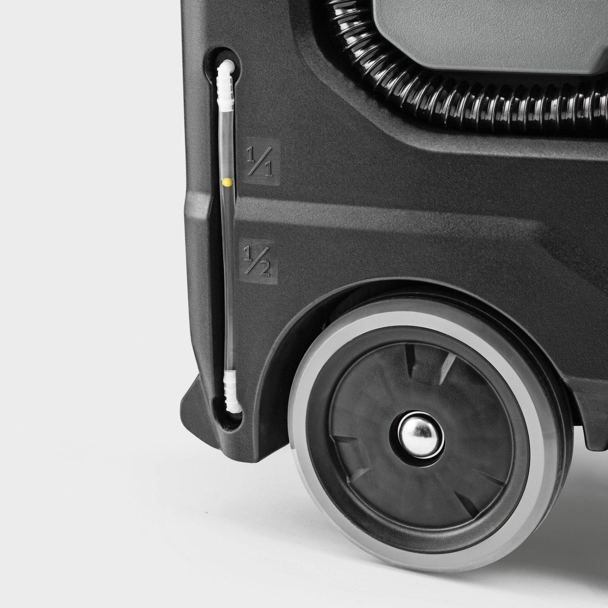Close-up of a floor scrubber wheel on a light gray background
