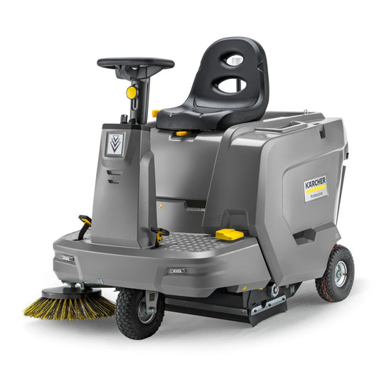 Gray Karcher KM 85/50R Bp Ride on sweeper with yellow brush on a white background